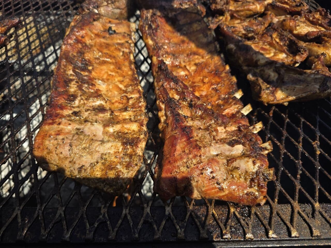 Racks of ribs on the open-flame grate